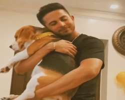 The actor is often seeing playing with his pet dog, Benzi.